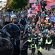 Left: Police officers in riot gear at anti-racism protests in Washington D.C. on June 1, 2020. Right: Trump supporters face off with police in Washington D.C. on January 6, 2021.